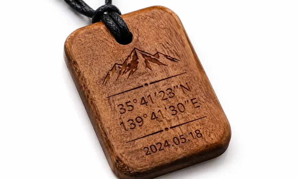 Custom wooden car pendant with laser-engraved coordinates and date on teak wood