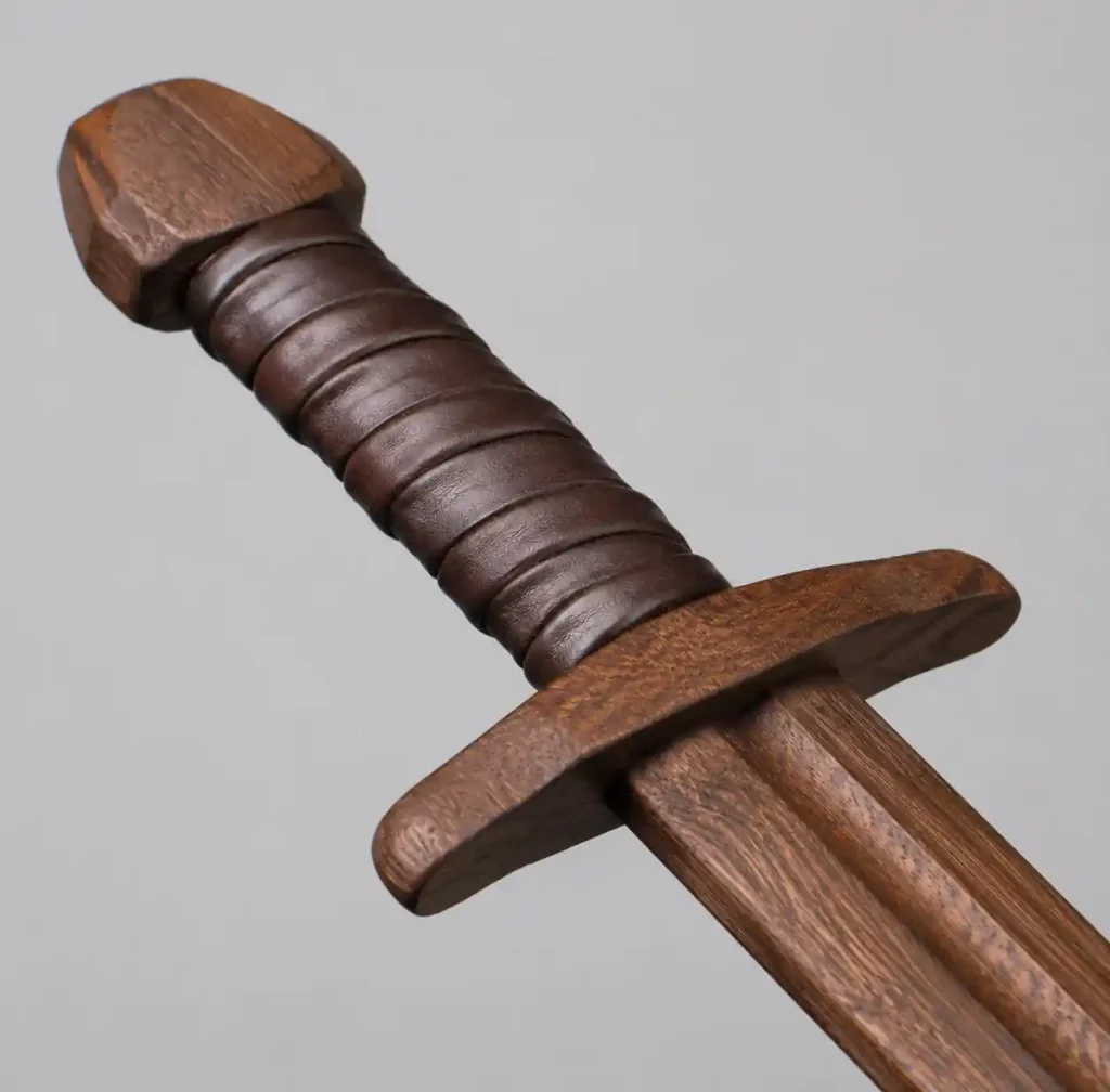 Hand-carved European longsword waster showing crossguard and grip detail