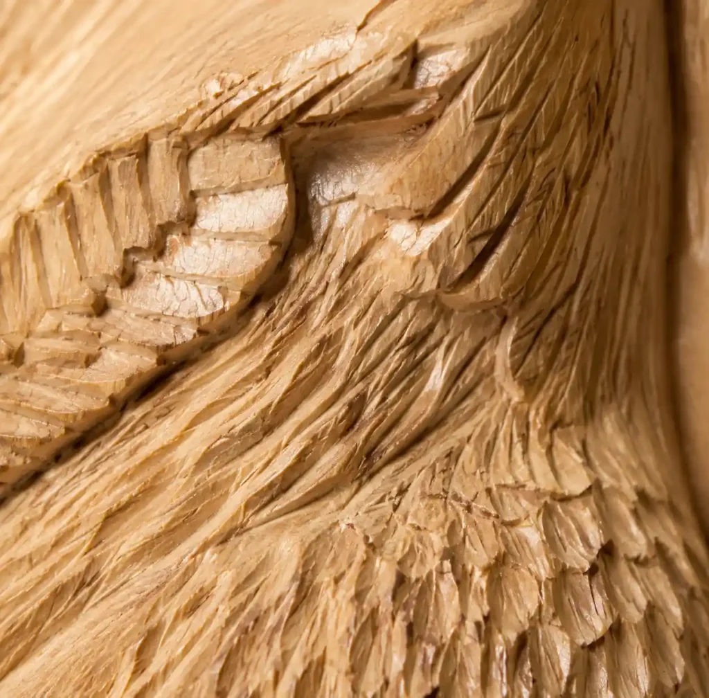 close up showing irregular hand carved tool marks versus uniform machine marks