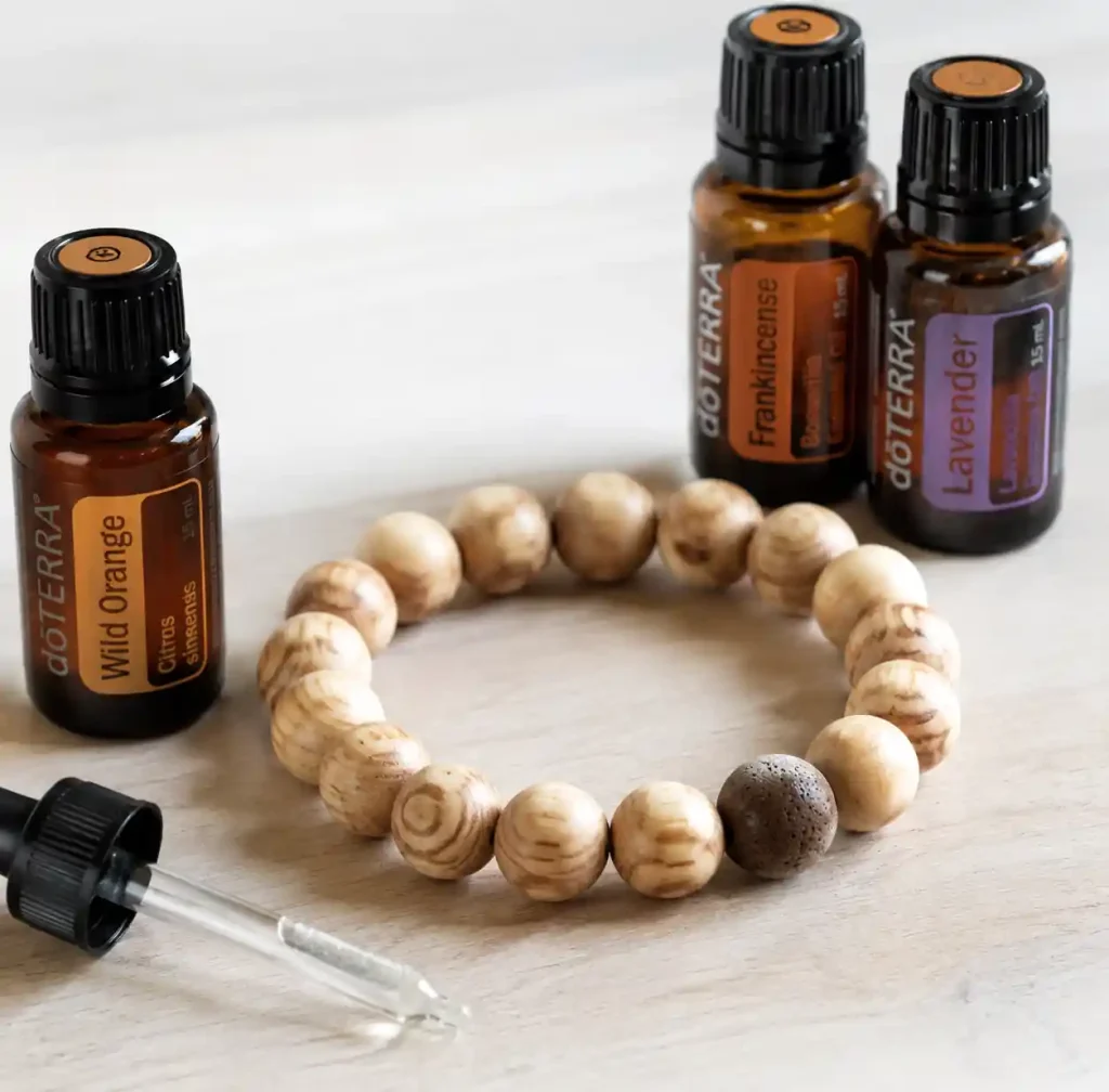 wooden bead bracelet with essential oil bottles for aromatherapy enhancement