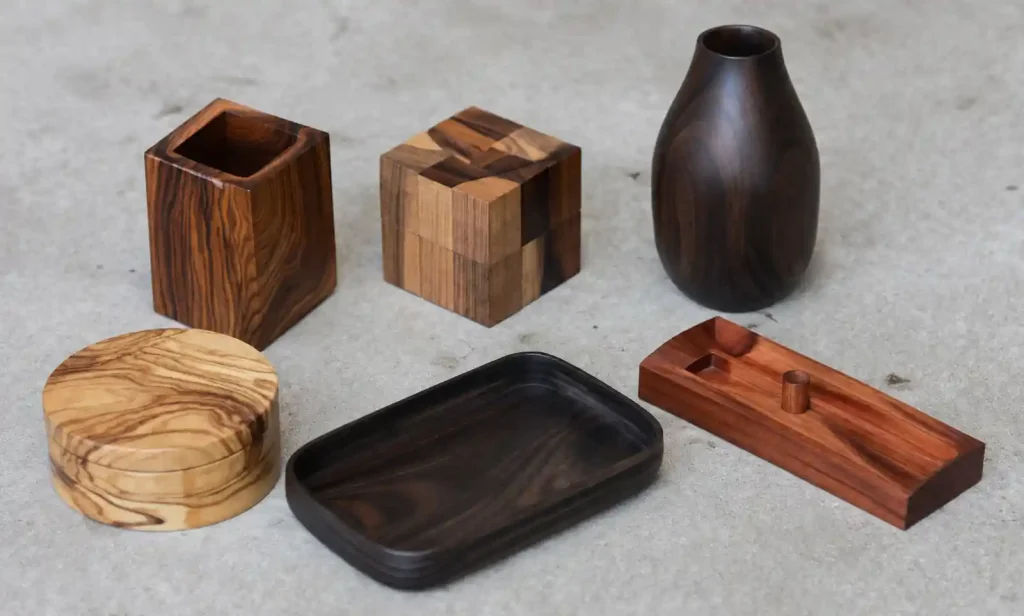 Variety of wooden corporate gift items showing different African and Middle Eastern wood species